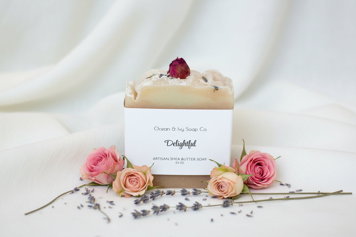 Artisan soap bar with a rose petal on top, branded as Ocean & Ivy Soap Co.