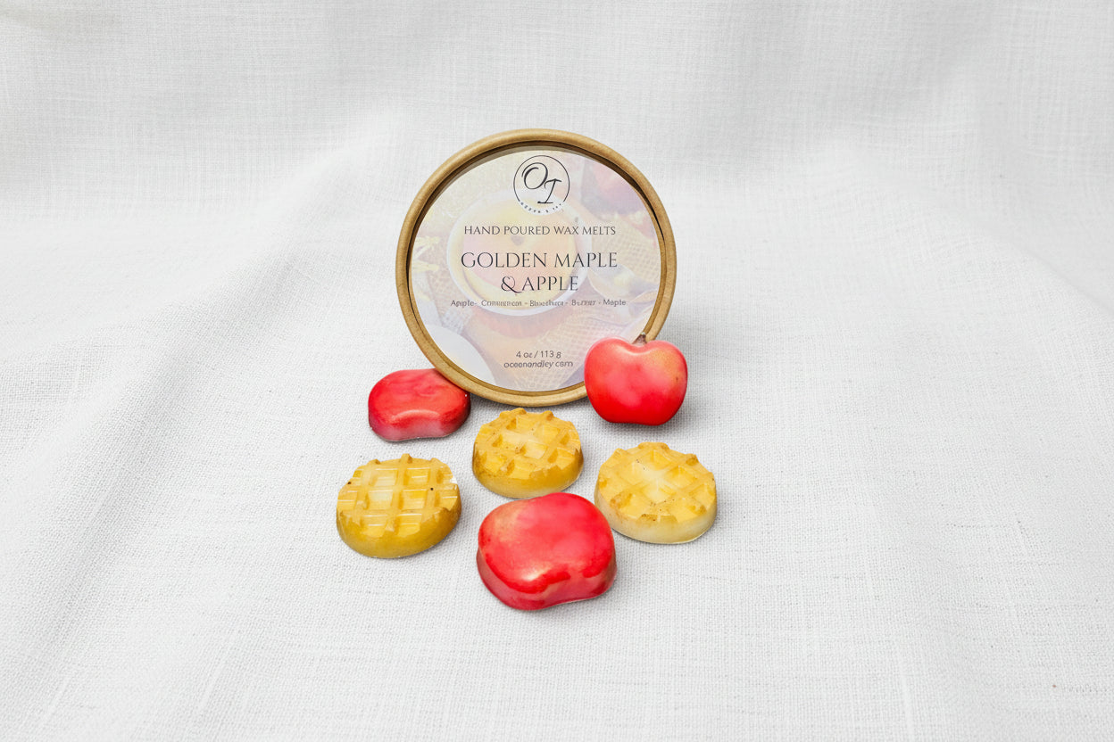 Wax melts with 'Golden Maple & Apple' packaging on a white background