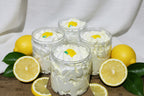 Jars of Sweet Sugared Lemon Sugar Whipped Soap with a creamy white color and decorative lemon slice on top